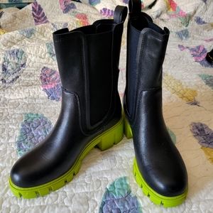 Neon green soled black boots